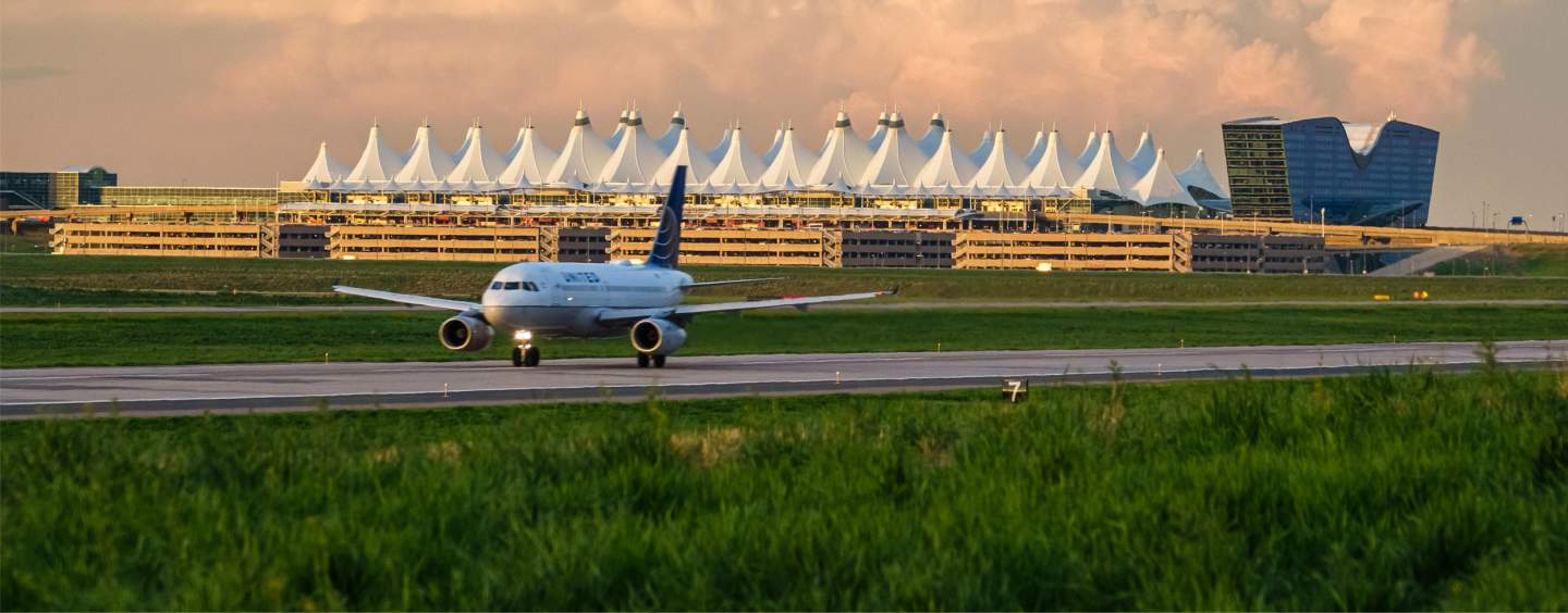Denver International Airport and Westin Hotel with Plane Taking Off in the Foreground